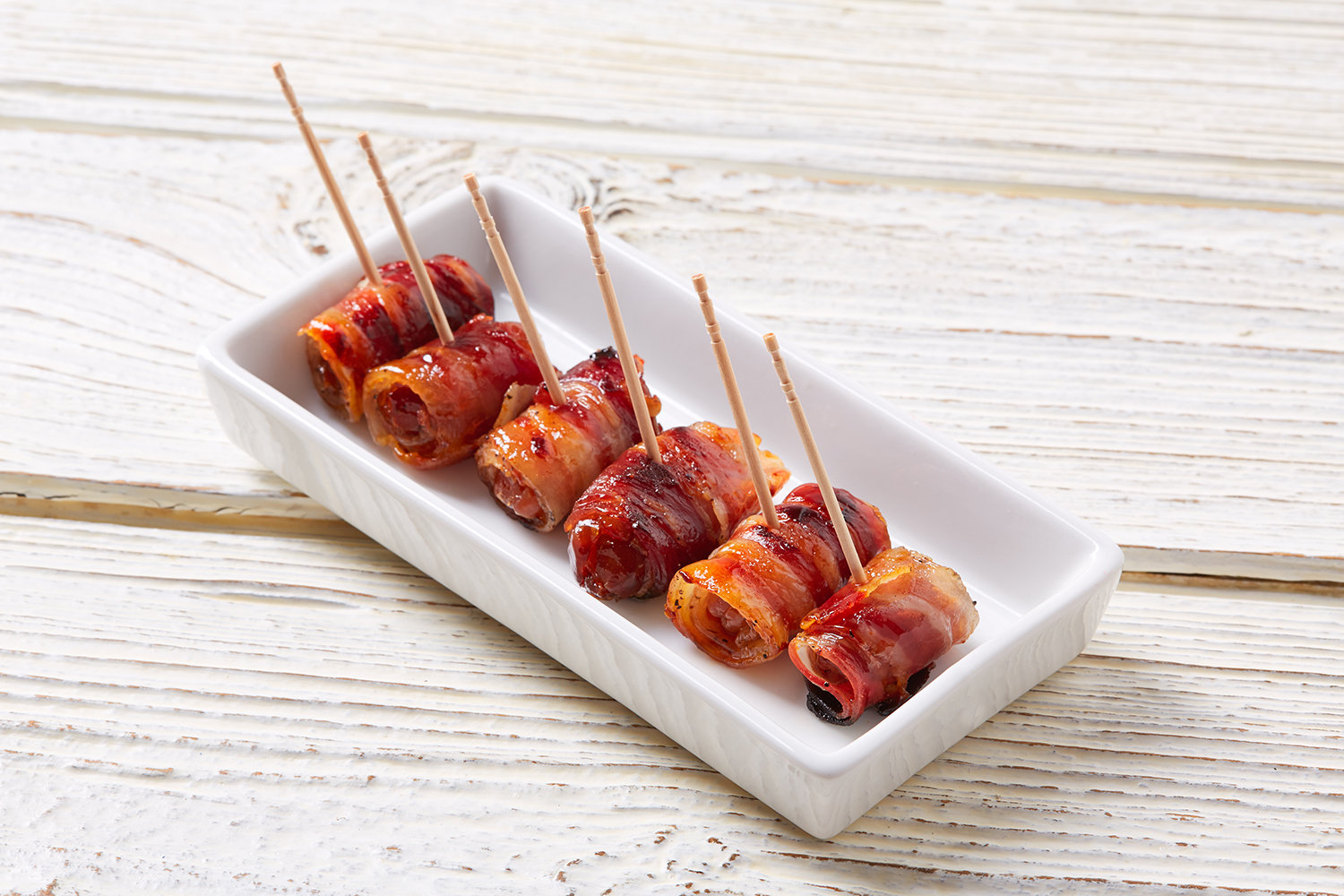 Sweet and savory bacon-wrapped dates tapas
